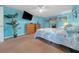 Bedroom with light blue walls and ceiling fan at 13588 Sw 105Th Pl, Dunnellon, FL 34432