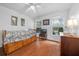 Cozy bedroom featuring wood floors and built-in drawers at 13588 Sw 105Th Pl, Dunnellon, FL 34432