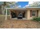 Carport with golf cart and storage shelving at 13588 Sw 105Th Pl, Dunnellon, FL 34432