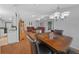 Bright dining area with wood table and leather chairs, adjacent to kitchen at 13588 Sw 105Th Pl, Dunnellon, FL 34432