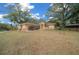 Single-story house with a landscaped yard and large oak trees at 13588 Sw 105Th Pl, Dunnellon, FL 34432