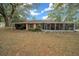 Single story house with a screened porch and carport at 13588 Sw 105Th Pl, Dunnellon, FL 34432