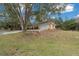 House front view with driveway and landscaping at 13588 Sw 105Th Pl, Dunnellon, FL 34432