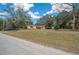 Single story house with driveway and grassy yard at 13588 Sw 105Th Pl, Dunnellon, FL 34432