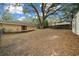 Side view of house with mature landscaping and shed at 13588 Sw 105Th Pl, Dunnellon, FL 34432