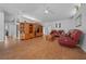 Living room featuring hardwood floors and a wood entertainment center at 13588 Sw 105Th Pl, Dunnellon, FL 34432