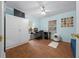 Home office with wood floors and built-in white wardrobe at 13588 Sw 105Th Pl, Dunnellon, FL 34432