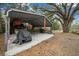 Covered patio area with concrete flooring and storage at 13588 Sw 105Th Pl, Dunnellon, FL 34432