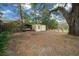 Backyard with storage container and seating area at 13588 Sw 105Th Pl, Dunnellon, FL 34432