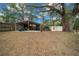 Backyard with covered storage area and additional shed at 13588 Sw 105Th Pl, Dunnellon, FL 34432