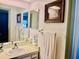 Clean bathroom with vanity and mirror at 13635 Berkshire Ct, Grand Island, FL 32735