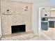 White brick fireplace in living room at 13635 Berkshire Ct, Grand Island, FL 32735