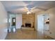 Living room with a brick fireplace and tile floors at 13635 Berkshire Ct, Grand Island, FL 32735