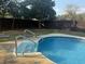 Inviting above ground pool with steps and surrounding yard at 13635 Berkshire Ct, Grand Island, FL 32735