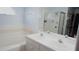 Bathroom with a bathtub, double vanity, and shower at 137 Country Lakes Cir, Groveland, FL 34736