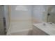 Bathroom features a bathtub, double vanity, and shower at 137 Country Lakes Cir, Groveland, FL 34736