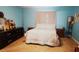 Bedroom with double bed, light blue walls, and carpeted floor at 137 Country Lakes Cir, Groveland, FL 34736