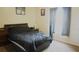 Bedroom with a double bed and dark bedding at 137 Country Lakes Cir, Groveland, FL 34736