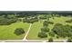 Aerial view of expansive property with multiple buildings at 1392 Sw 103Rd Ave, Webster, FL 33597