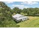 Aerial view of charming farmhouse on large lot at 1392 Sw 103Rd Ave, Webster, FL 33597