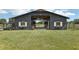 Large barn with stalls, wooden beams and white accents at 1392 Sw 103Rd Ave, Webster, FL 33597