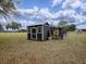 Chicken coop with attached shed and run in a rural setting at 1392 Sw 103Rd Ave, Webster, FL 33597