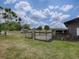 Chicken coop and run alongside a rustic barn at 1392 Sw 103Rd Ave, Webster, FL 33597