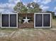 Rustic chicken coop with a large white star in the center at 1392 Sw 103Rd Ave, Webster, FL 33597