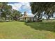 Single story home with stone fireplace and lush lawn at 1392 Sw 103Rd Ave, Webster, FL 33597