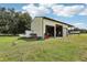 Tan metal garage with double doors at 1392 Sw 103Rd Ave, Webster, FL 33597