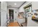 White kitchen with butcher block countertops and access to the laundry area at 1392 Sw 103Rd Ave, Webster, FL 33597