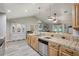 Spacious kitchen featuring tile counters and ample cabinetry at 1392 Sw 103Rd Ave, Webster, FL 33597