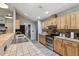 Modern kitchen with stainless steel appliances and light wood cabinets at 1392 Sw 103Rd Ave, Webster, FL 33597