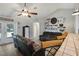 Cozy living room with brown leather couches and a ceiling fan at 1392 Sw 103Rd Ave, Webster, FL 33597