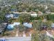 Aerial view of a house nestled in a quiet residential neighborhood at 1395 Morningside St, Mount Dora, FL 32757