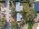 Aerial view of a single-Gathering home on a tree-lined street at 1395 Morningside St, Mount Dora, FL 32757