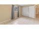 Bedroom with tile floors, neutral walls, and built-in closet at 1395 Morningside St, Mount Dora, FL 32757