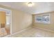 Bright bedroom with tile floors, neutral walls and a window at 1395 Morningside St, Mount Dora, FL 32757