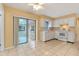 White kitchen with appliances and access to patio at 1395 Morningside St, Mount Dora, FL 32757