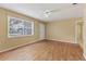 Simple living room with laminate flooring and ceiling fan at 1395 Morningside St, Mount Dora, FL 32757