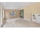 Bright sunroom with tile floors, window and sliding glass door at 1395 Morningside St, Mount Dora, FL 32757