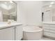 Bathroom with a large vanity, soaking tub, and shower at 14 Camino Real Blvd # 14, Howey In The Hills, FL 34737