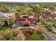 Aerial view of clubhouse with pool and parking at 14 Camino Real Blvd # 14, Howey In The Hills, FL 34737