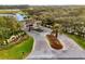 Gated community entrance with landscaping at 14 Camino Real Blvd # 14, Howey In The Hills, FL 34737