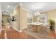 Formal dining area with hardwood floors and chandelier at 14 Camino Real Blvd # 14, Howey In The Hills, FL 34737