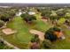 Aerial view of a lush green golf course at 14 Camino Real Blvd # 14, Howey In The Hills, FL 34737