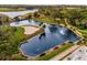 Aerial view of a scenic golf course with water features at 14 Camino Real Blvd # 14, Howey In The Hills, FL 34737