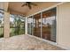 Screened porch with sliding glass doors and golf course views at 14 Camino Real Blvd # 14, Howey In The Hills, FL 34737