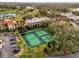 Aerial view of tennis courts near hotel building at 14 Camino Real Blvd # 14, Howey In The Hills, FL 34737