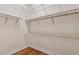 Large walk-in closet with wire shelving and hanging rods at 14 Camino Real Blvd # 14, Howey In The Hills, FL 34737